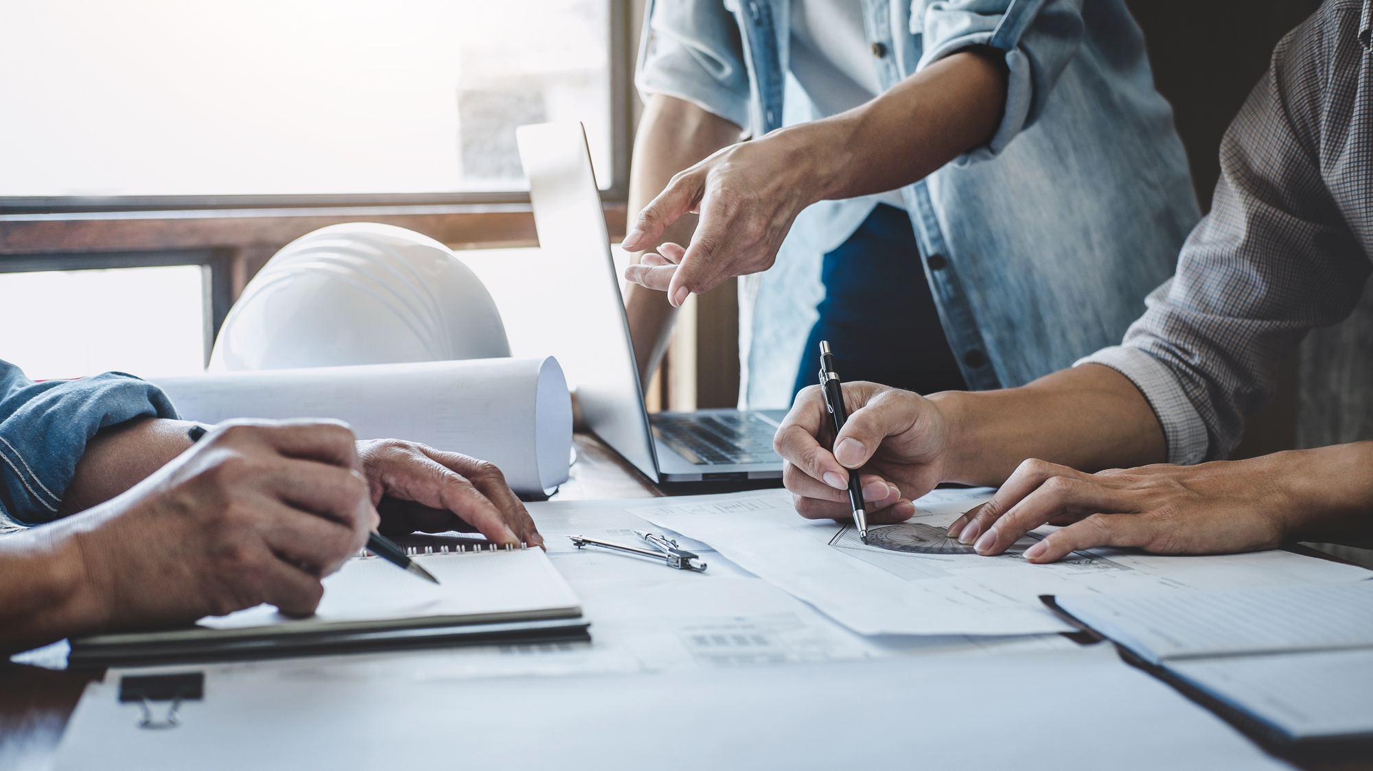 A Group Of People Working On A Project